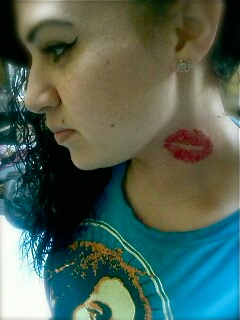 Red lips tattoo on neck